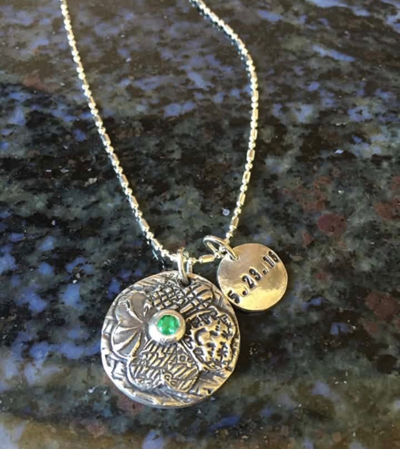 Four cousins flower pendant with green birthstone center